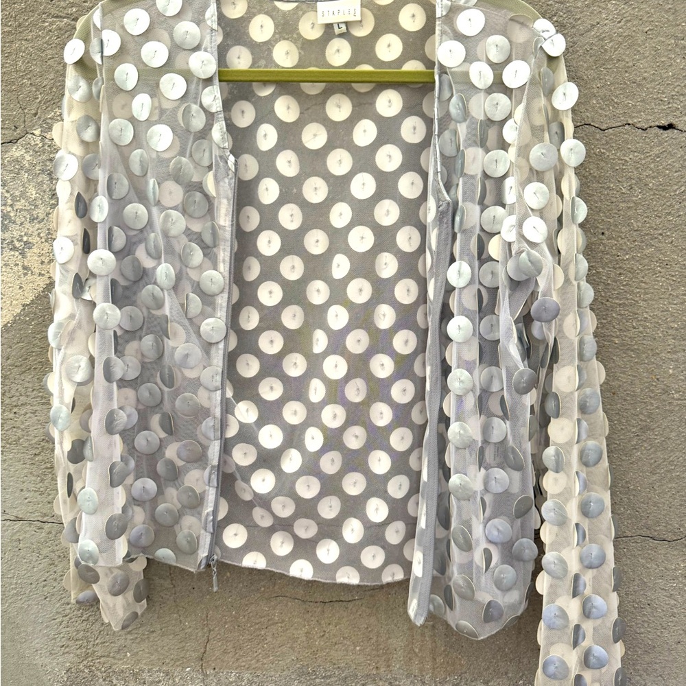 Mesh and vegan leather zippered top.